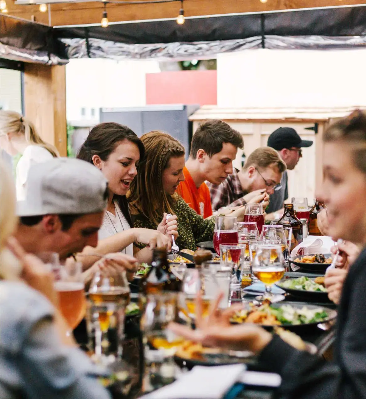 Group of people having meal together