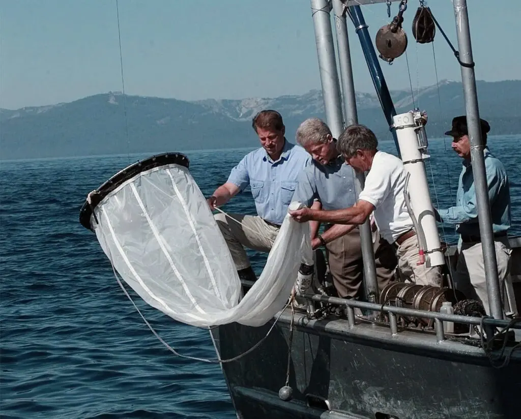 Al Gore and Bill Clinton on a boat with others