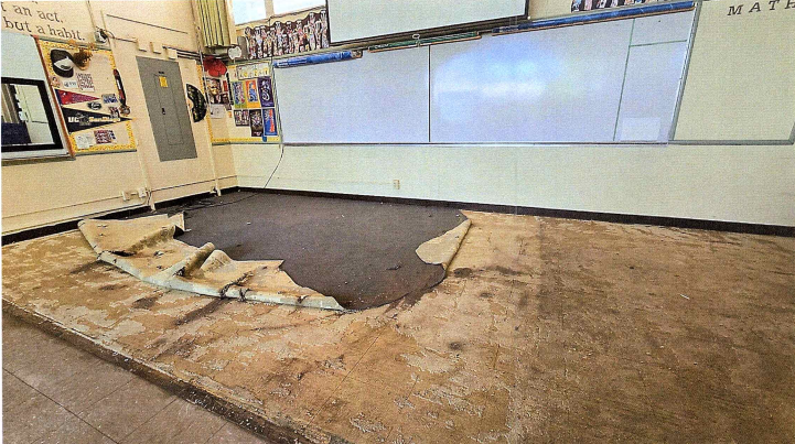 District documents included photos of the torn carpet in Jeanine Rupert's classroom.
