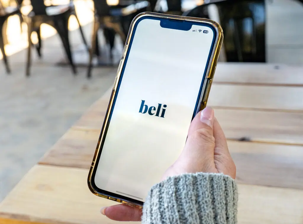 Janice Chan opens the Beli App at Emile's Cafe in West Sacramento on October 17, 2025.