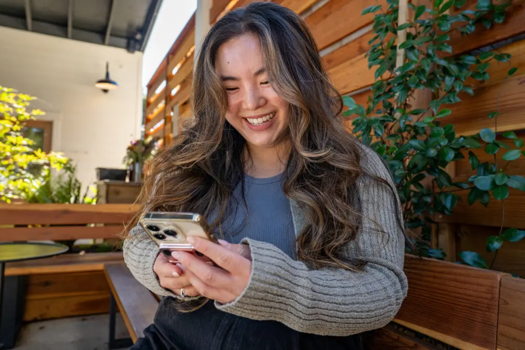Janice Chan scrolls through the Beli App at Emile's Cafe in West Sacramento on October 17, 2025.