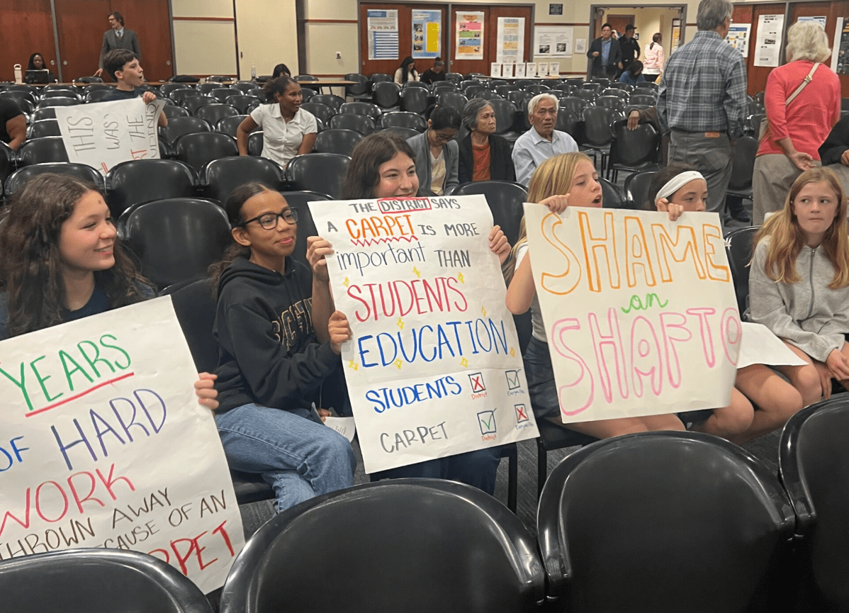 Students at the Oct. 2 SCUSD school board meeting protest their teacher's removal.