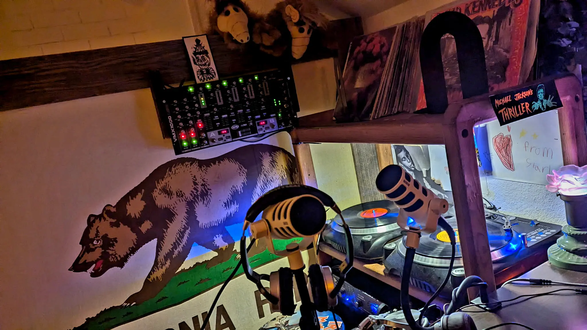 Pair of microphones and two turntables with spinning records