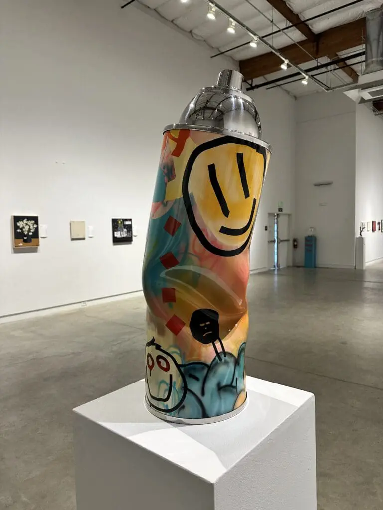 art in the shape of a spray can