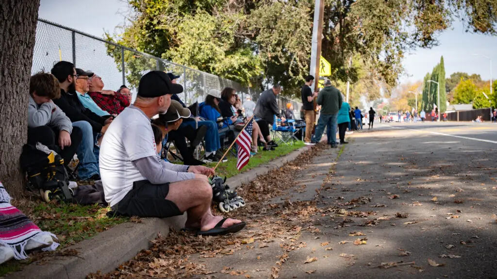people watch a parade