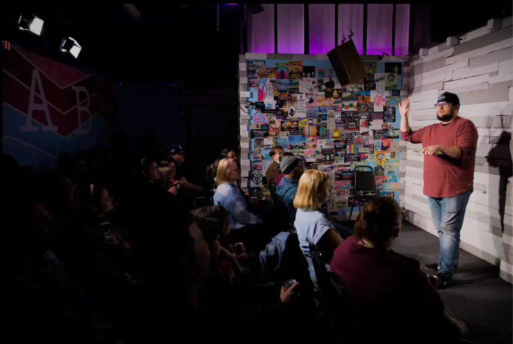 man performs at comedy club