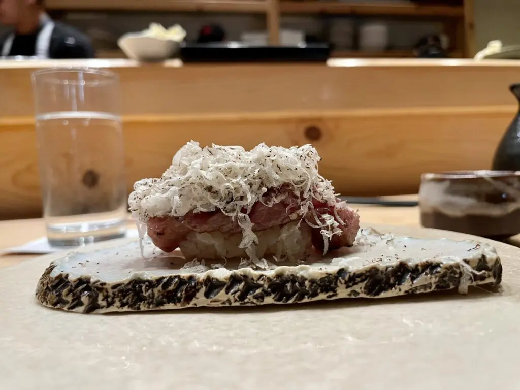 A5 Wagyu beef nigiri with white truffle shavings at Kru.