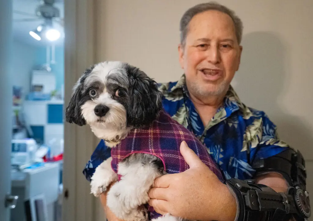 Man holding dog