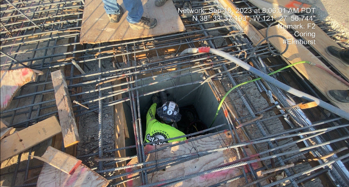 man in construction hole