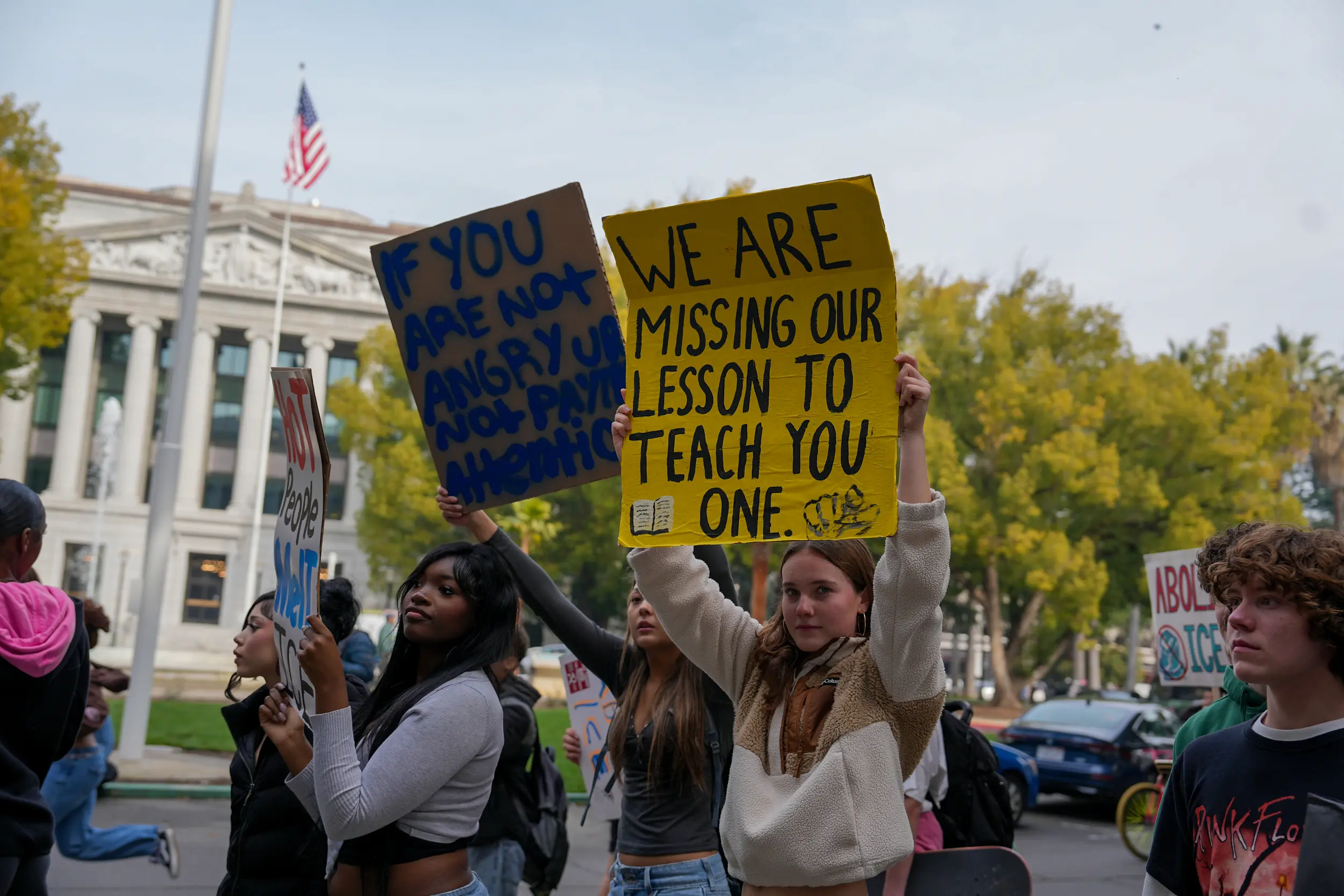 Student holds a sign