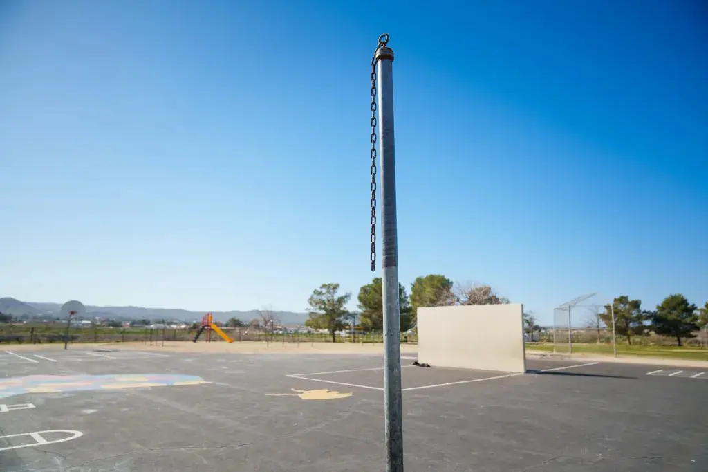 A pole with a chain but no play equipment at Gateway Elementary School