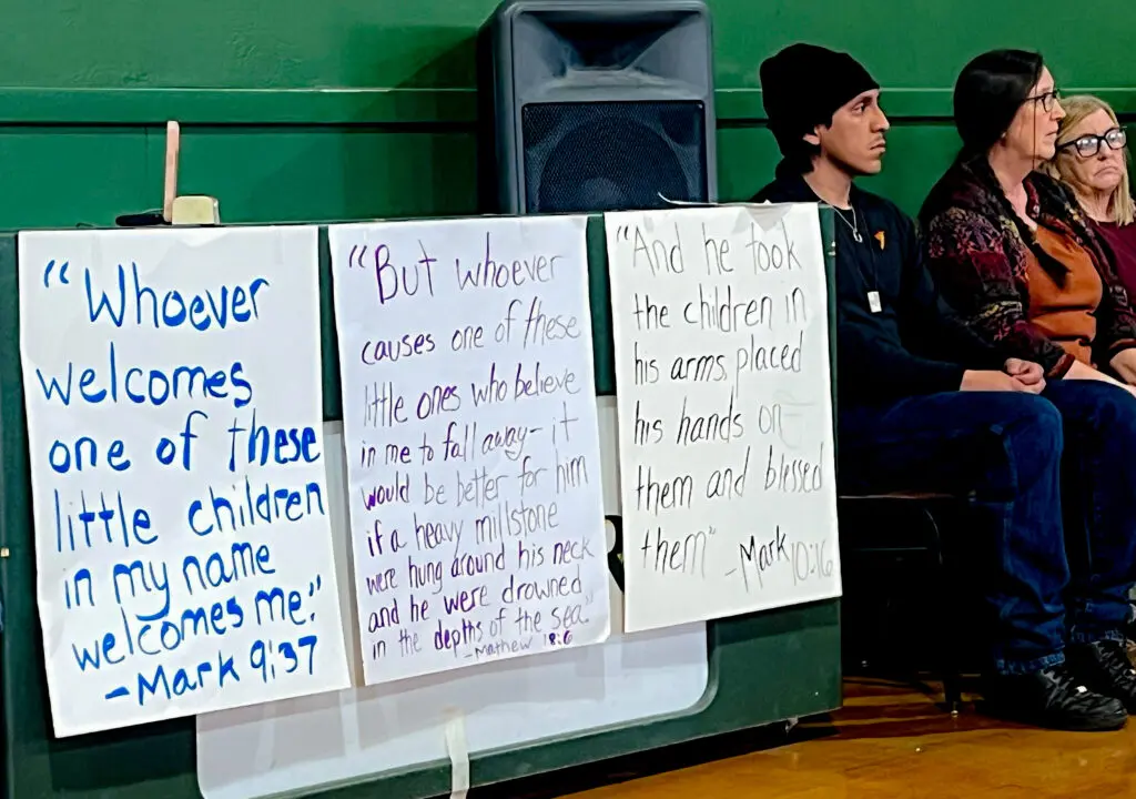 Protest signs in school gym