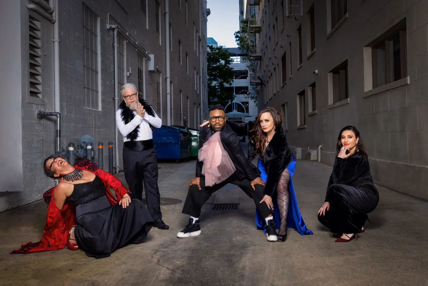 A band stands in a alley