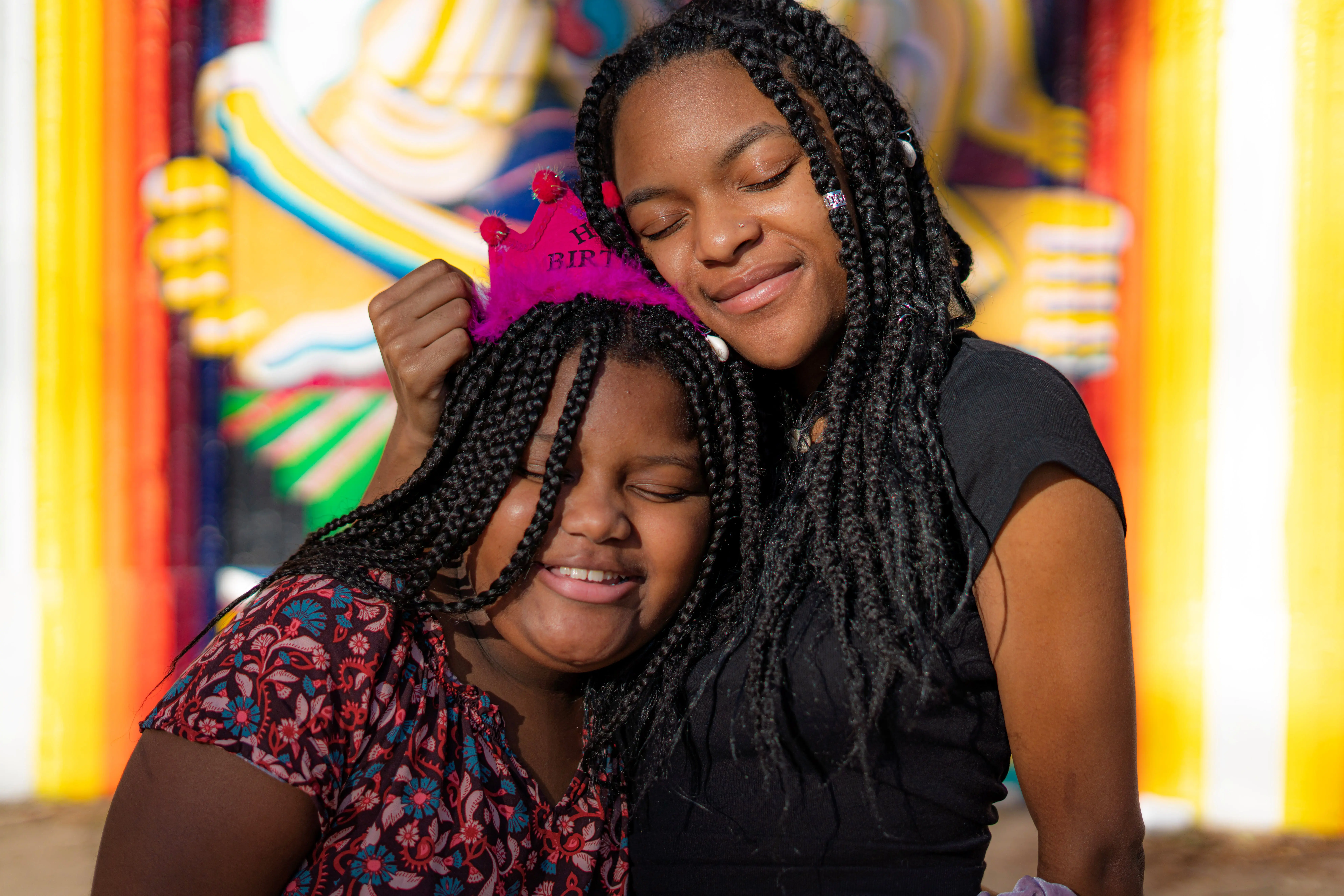 A mother and child share a hug