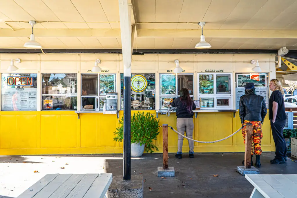 Patrons at hamburger stand