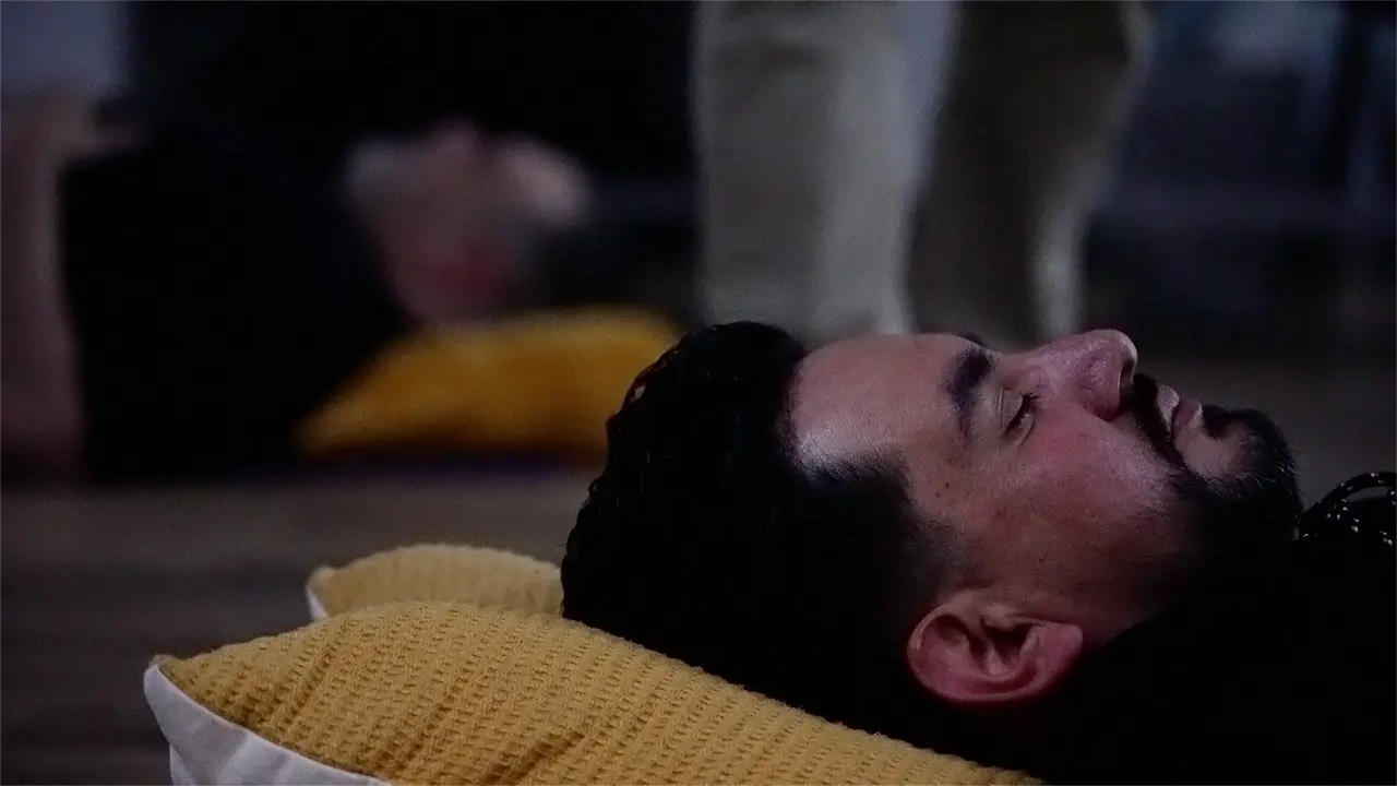 Man lays on a pillow