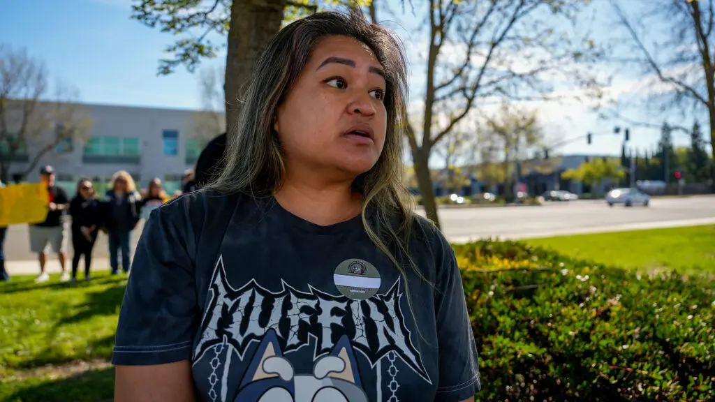 Christina Reyes Estrada, Natomas Unified School District parent, protesting on March 9, 2026. Photo by Denis Akbari.