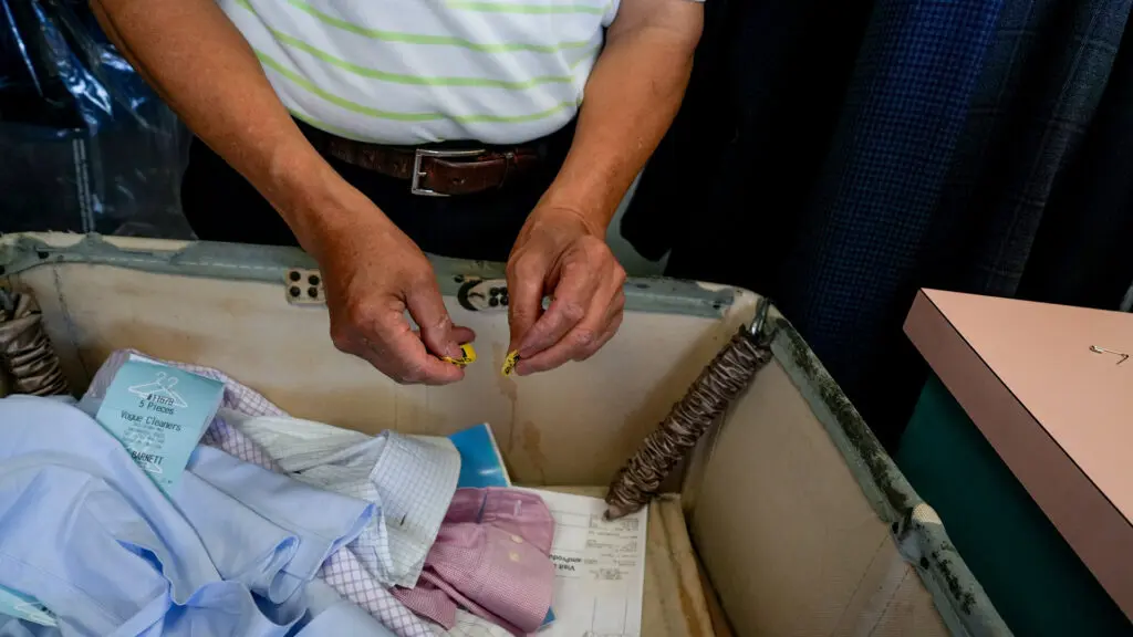 Ha Wan Ku, Vogue Cleaners owner, working on March 18, 2026. Photo by Denis Akbari.