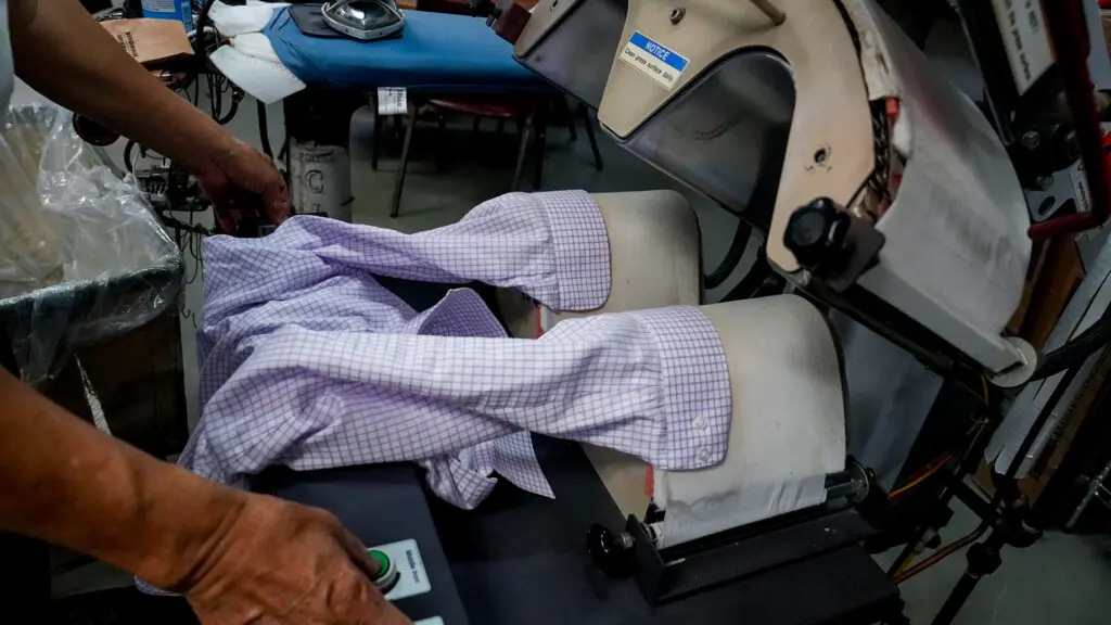 Ha Wan Ku, Vogue Cleaners owner, working on March 18, 2026. Photo by Denis Akbari.