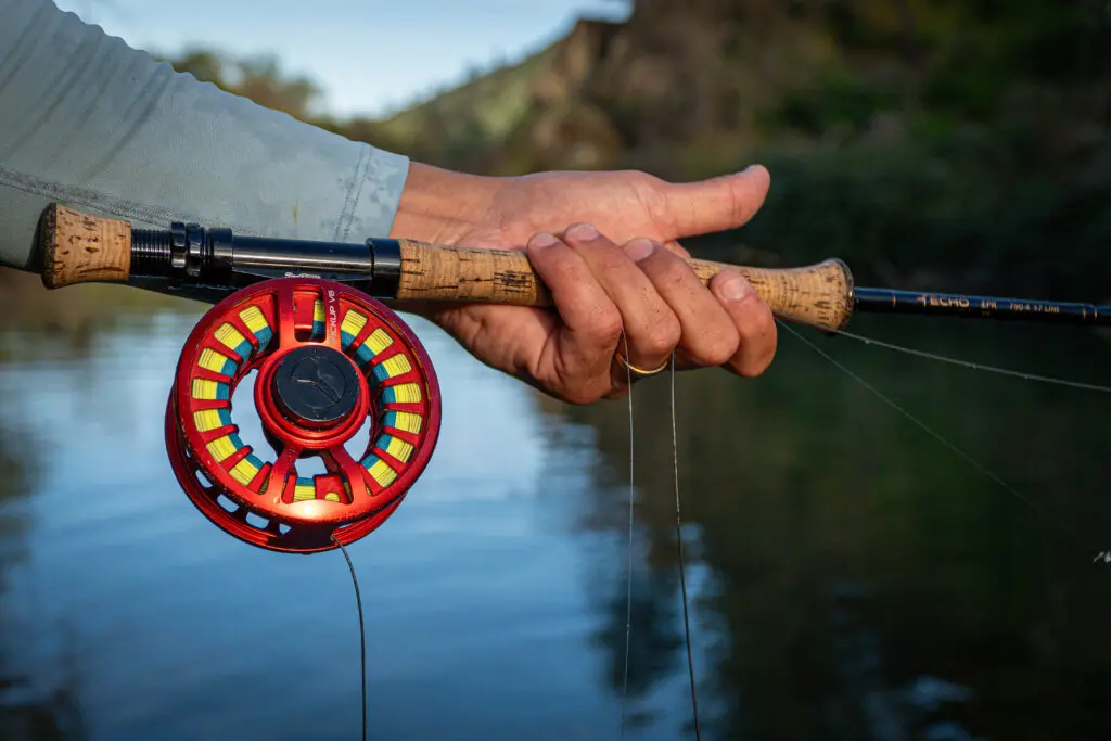 Man holding fly fishing pole