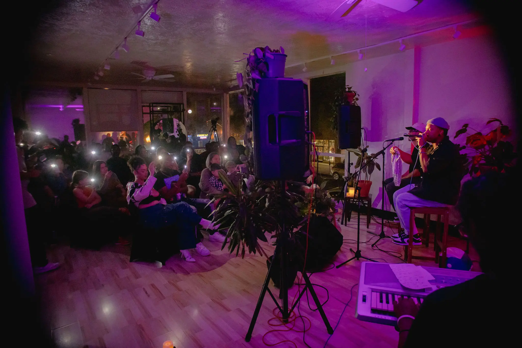 Artists performing for a small audience.