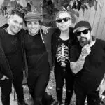 Black and white photo of four men
