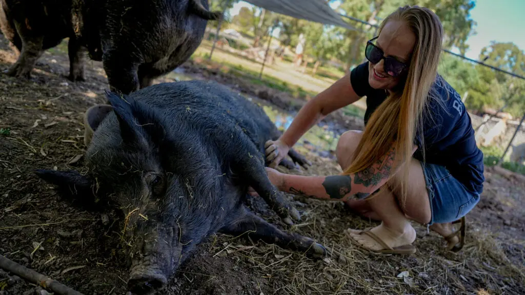 Sanctuary Mixtape pig Penelope with co-founder Kathryn Nicole on March 23, 2026. Photo by Denis Akbari.