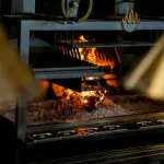 Wood and charcoal-fired grill at Aiona on 1213 K Street in Sacramento. Photo by Denis Akbari.