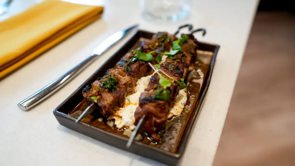 Lamb Souvlaki dish at Aiona. Photo by Denis Akbari.