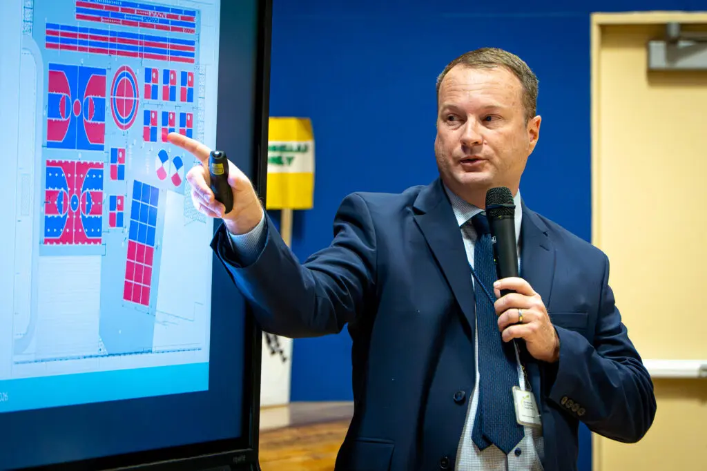 man pointing at screen