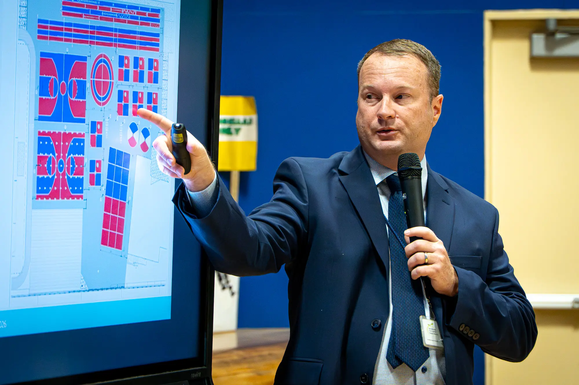 man pointing at screen