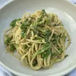 Plate of pasta with green vegetables