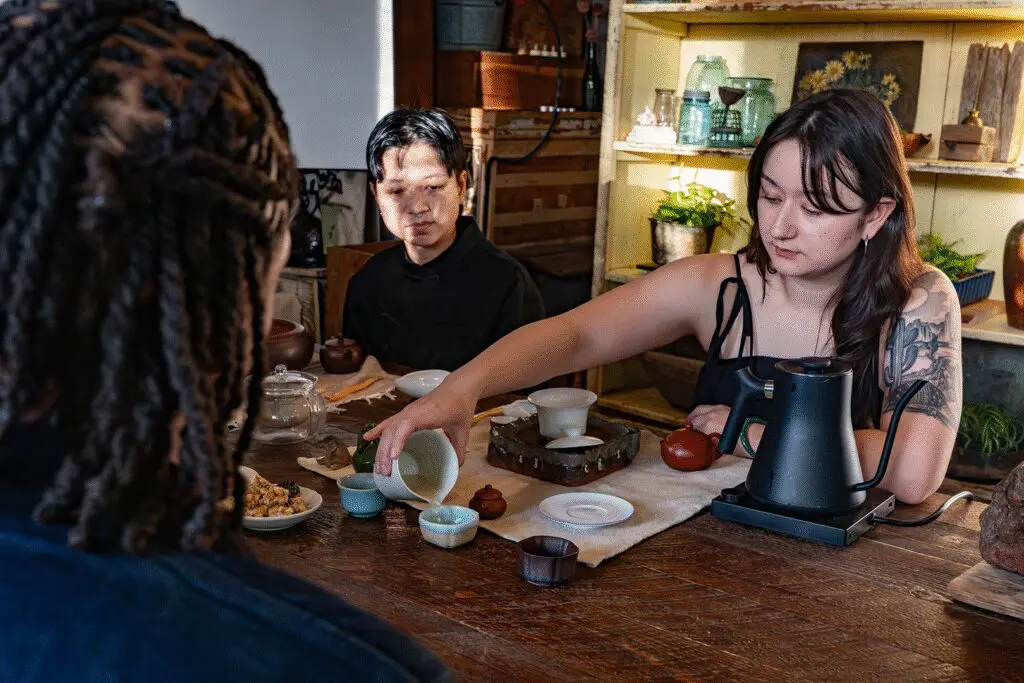 person pouring tea
