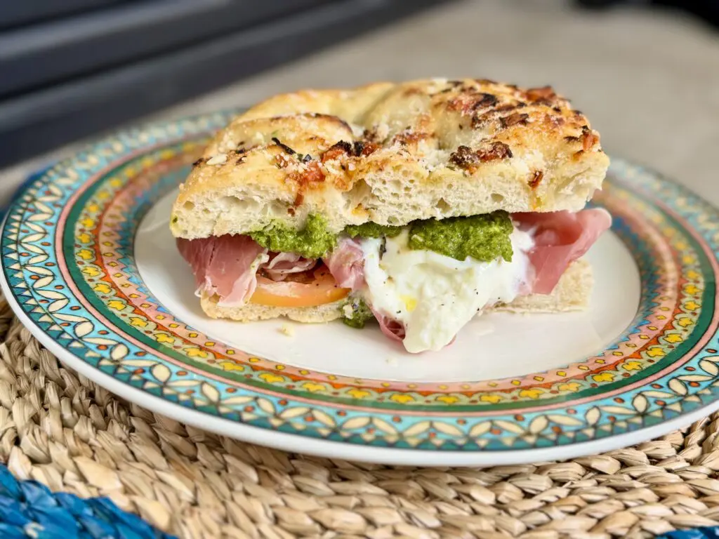 A burrata caprese sandwich with prosciutto, inspired by Bay Cities in Santa Monica.