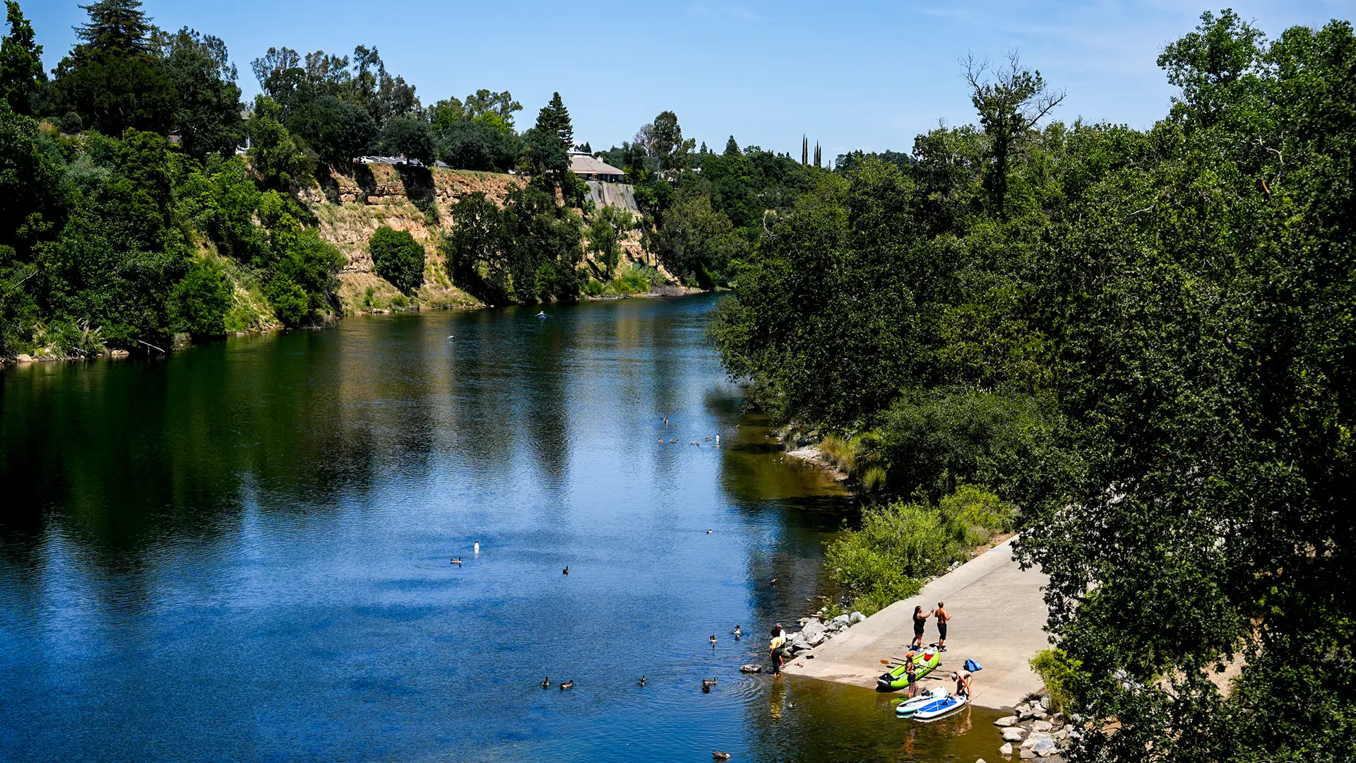 The Fair Oaks Bridge connects the bluffs to the trails below, and that crossing might be the single most iconic view in town. Photo by Denis Akbari.