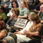 Crowd with sign