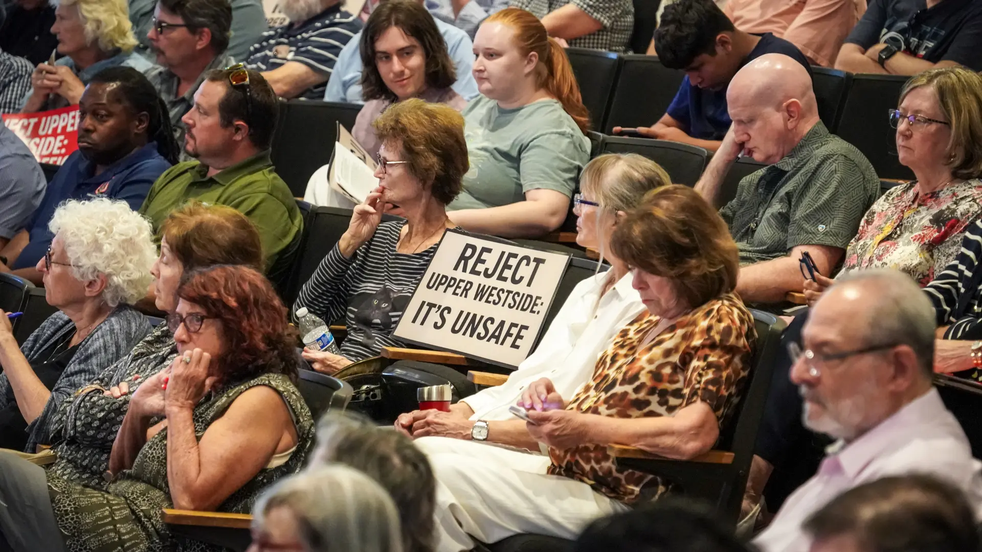 Crowd with sign