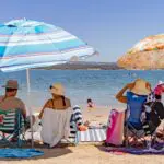 People sit at a beach