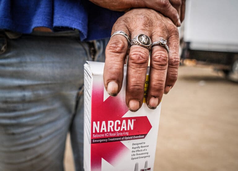 Narcan is distributed at a homeless encampment in Del Paso Heights on Sept. 9 by the Neighborhood Wellness Foundation.