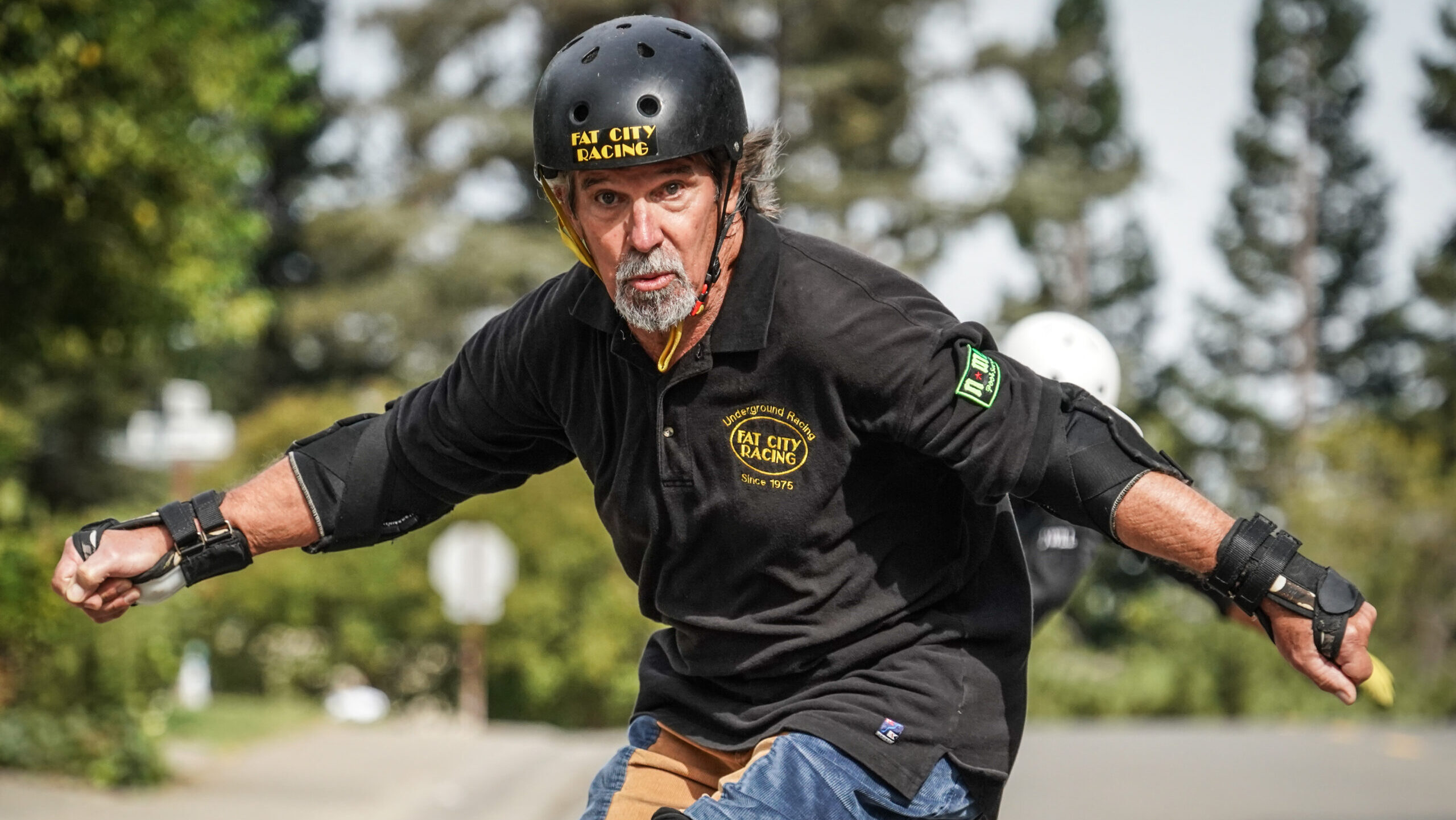 74-year-old Jamie Hart of Sierra Oaks practices skateboarding the slalom run.
