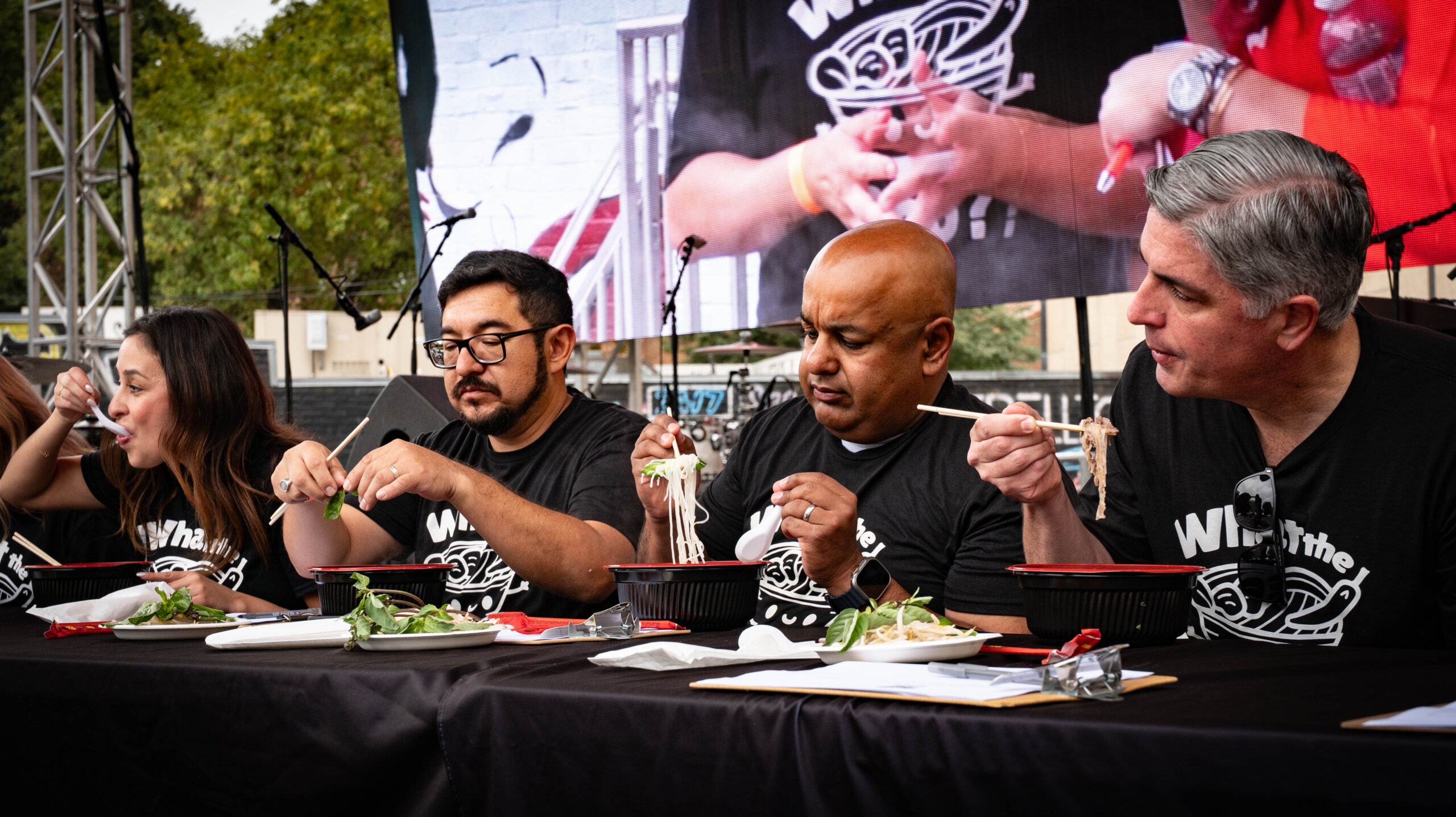 Judges, from left, — City Councilmembers Karina Talamantes and Eric Guerra, Sacramento County Sheriff’s Sgt. Amar Gandhi, and Councilmember Phil Pluckebaum — taste pho for the What the Pho Challenge at the Terra Madre Americas Street Festival on Sunday, Sept. 28, 2025.