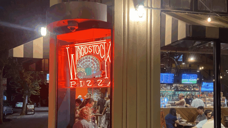 Woodstock's Pizza draws college students with the neon-lit promise of pizza, beer and Thursday night trivia.