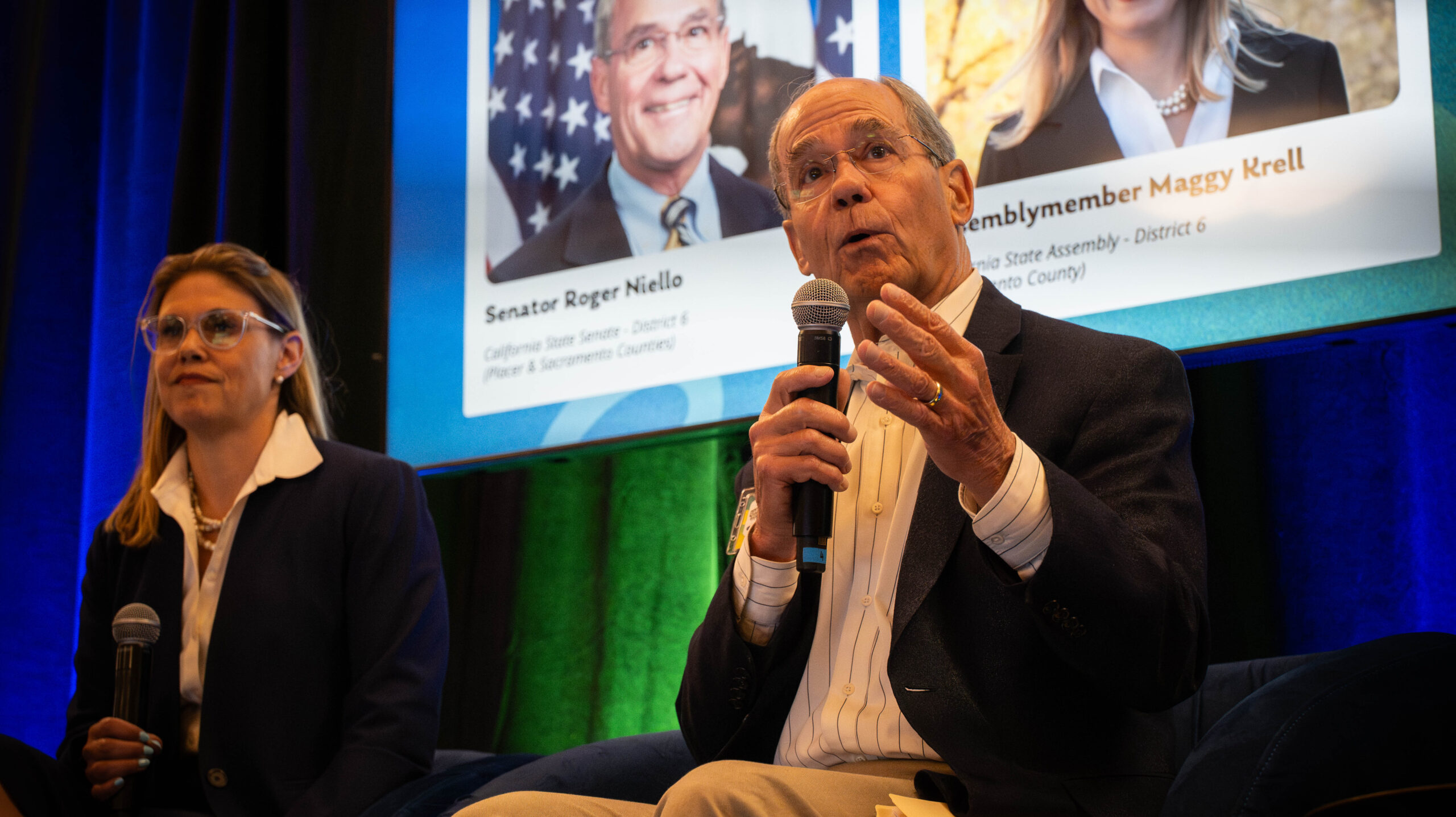 State Sen. Roger Niello, right, speaks alongside Assemblymember Maggy Krell at  Valley Vision's Livability Summit 2025 on Wednesday, Oct. 1, 2025, in Citrus Heights.