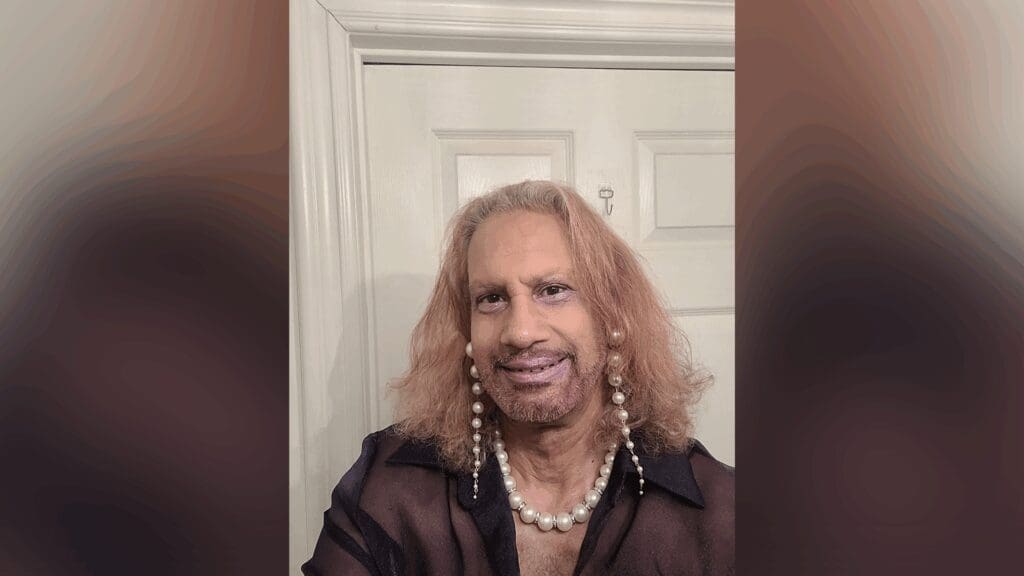 man wearing pearl earrings