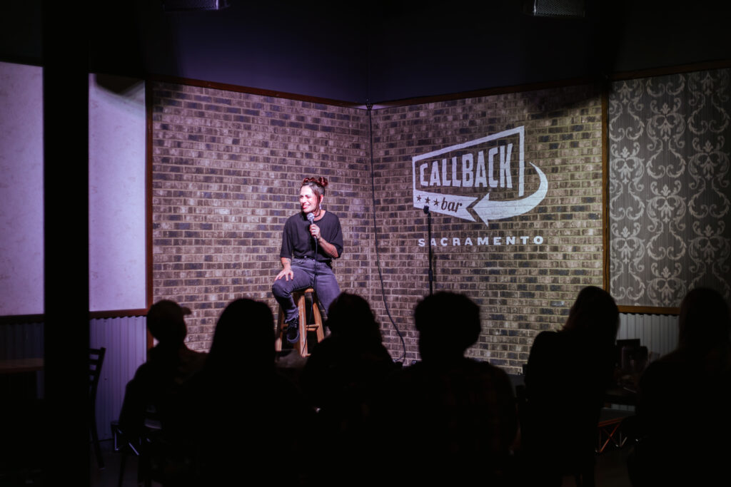 woman performs comedy