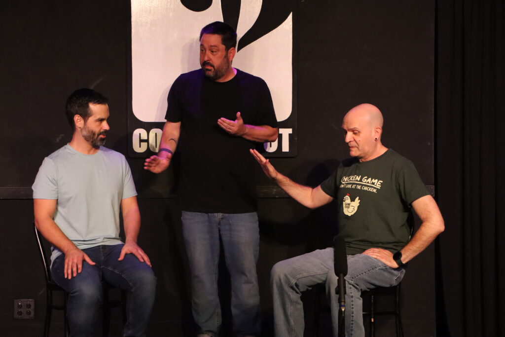 three men perform comedy