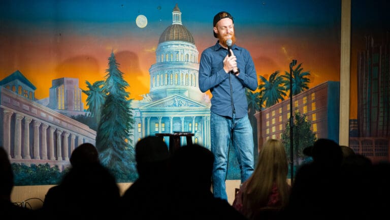 man performs comedy