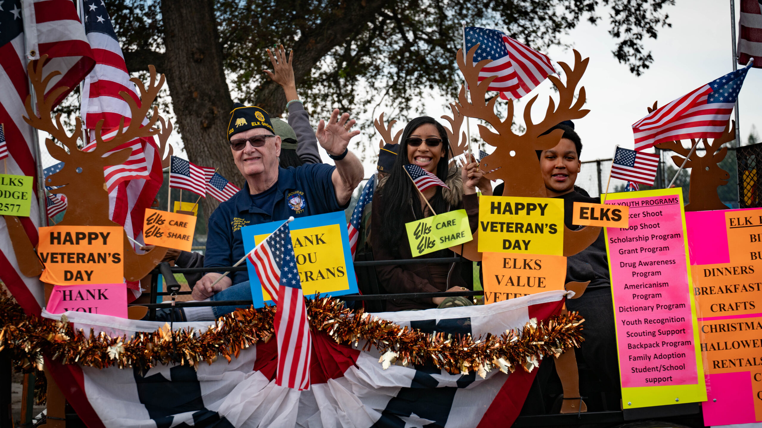 people waving on a float