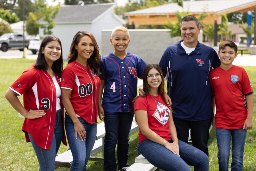family photo in baseball uniforms