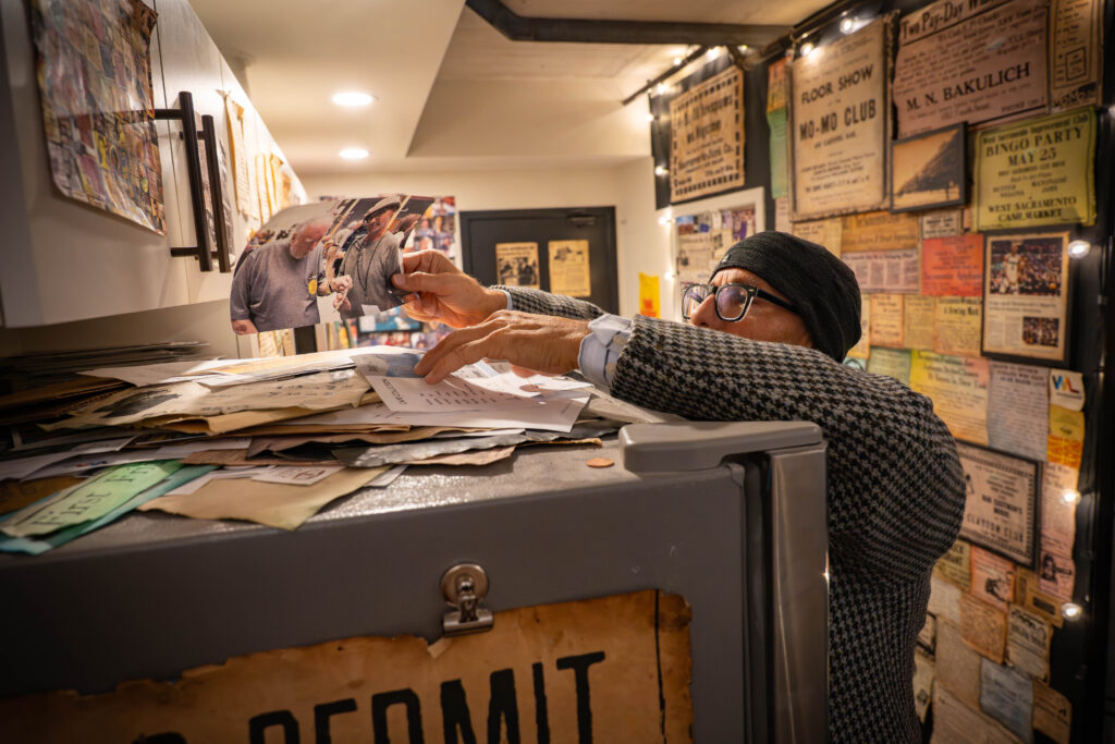 man searching through papers